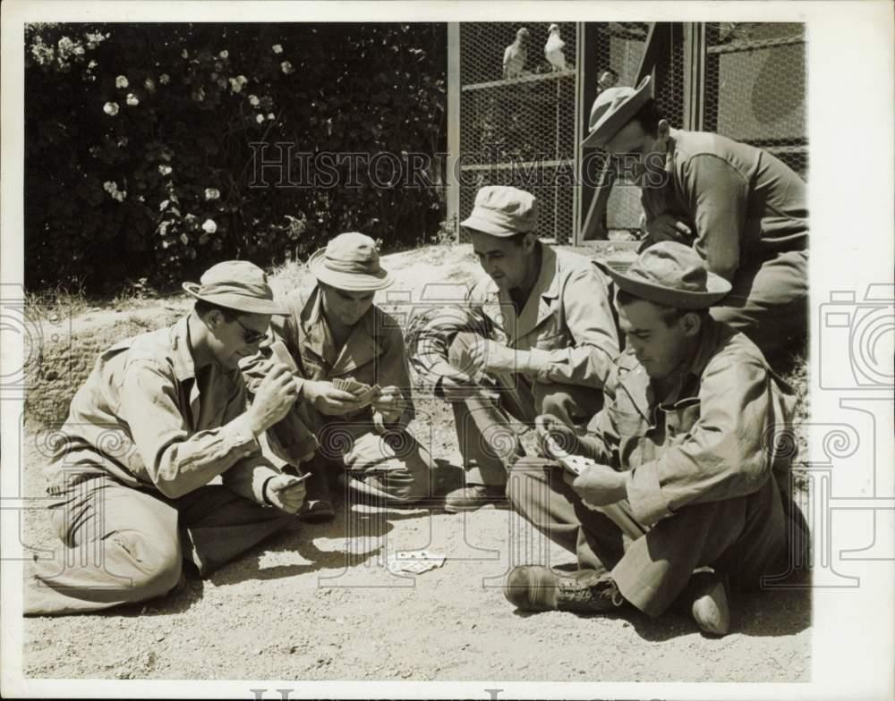 1949 Press Photo United States Army soldiers playing cards near pigeon loft