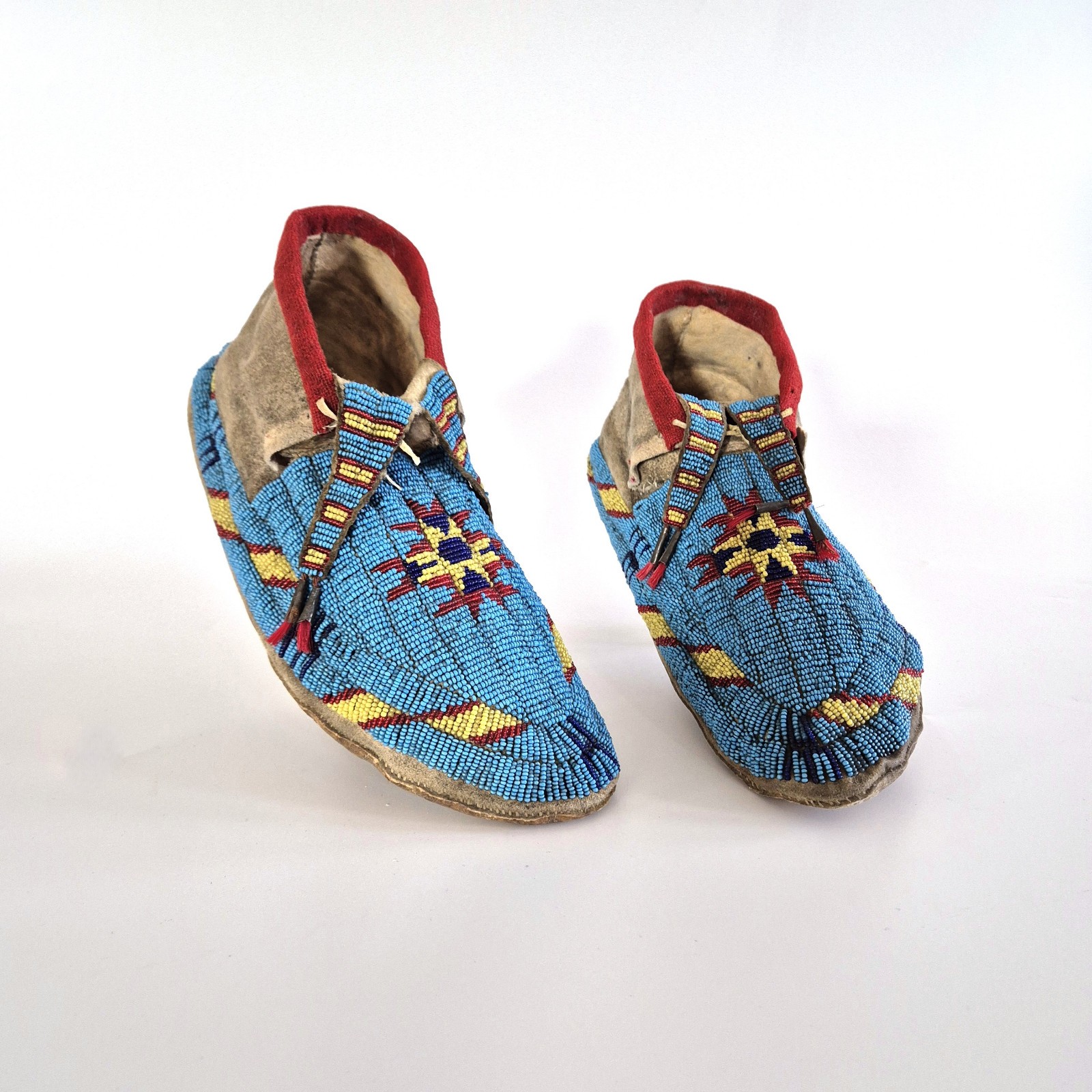 Antique Northern Sioux Beaded Hide Men's Moccasins, circa 1880s-1890s.