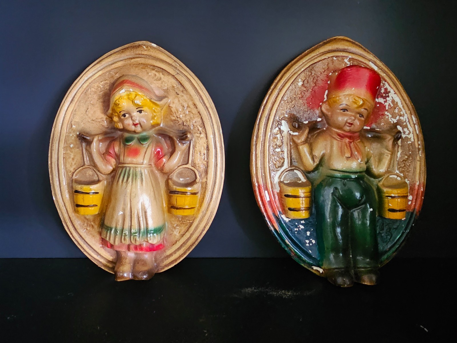 Vintage 1950s Chalkware Dutch Boy & Girl Water Carriers Wall Plaques — Pair