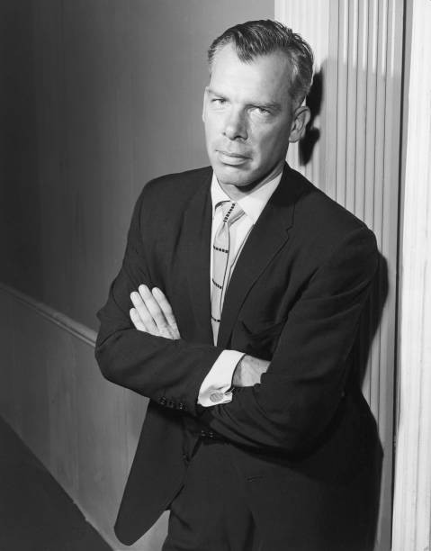 Portrait American actor Lee Marvin leaning against a wall a suit Old Photo