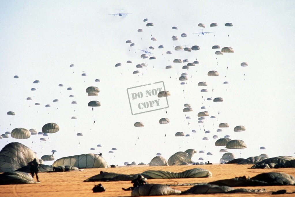 US Air Force Airborne Division land after jumping C-141B Starlifter aircraft