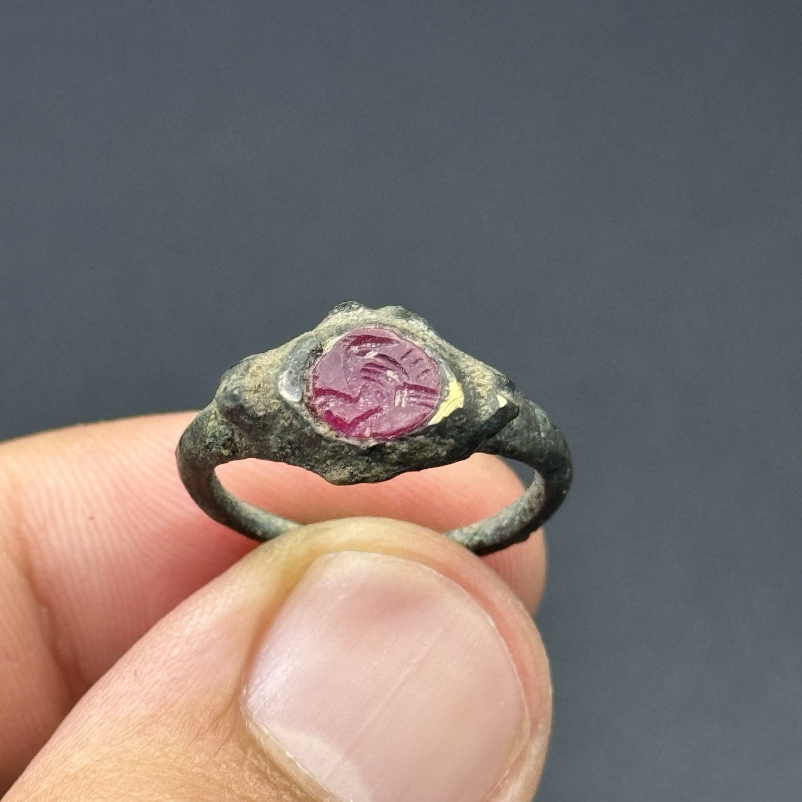 Ancient Roman Bronze ring with Ruby Engraved Bezel