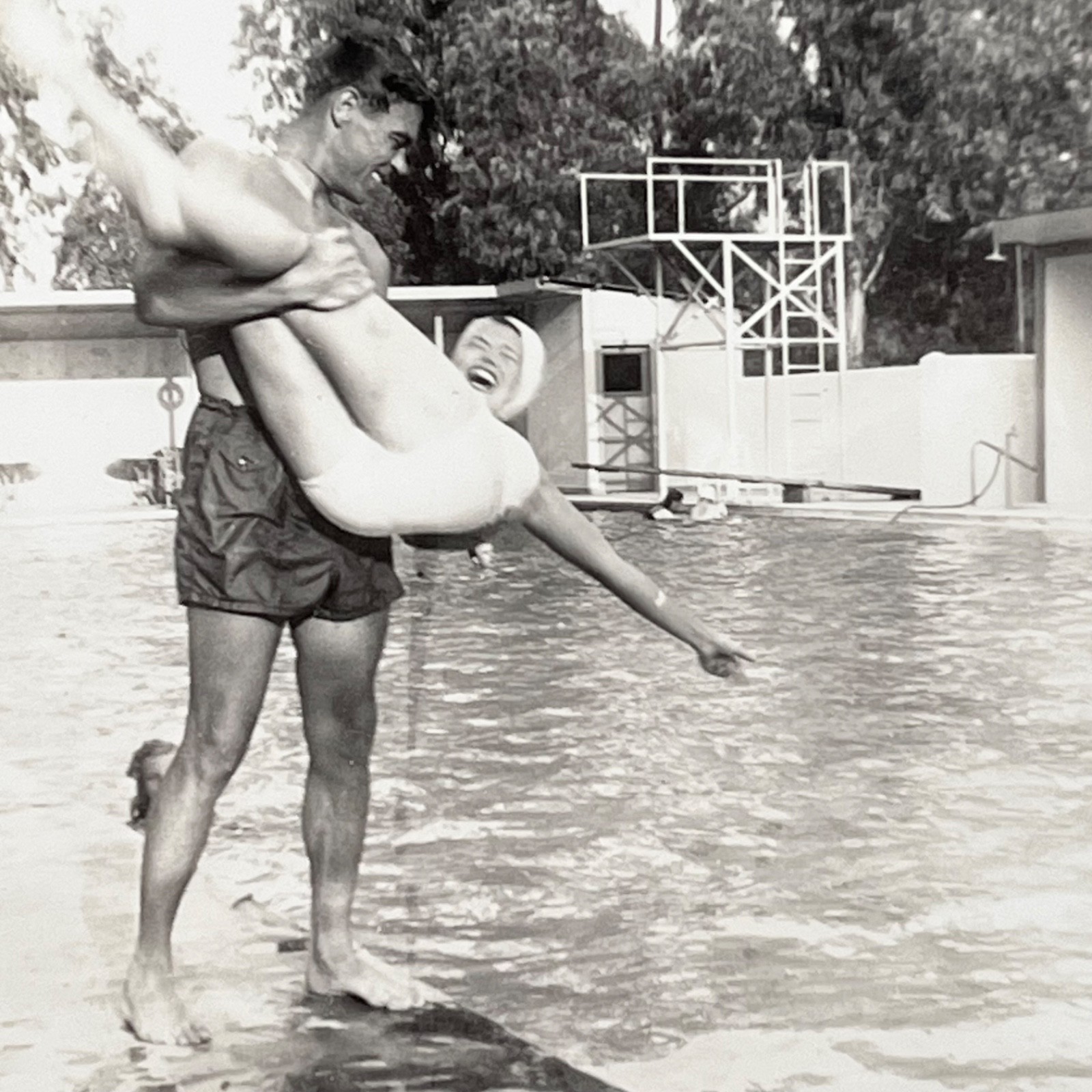 1940s Man Tossing Woman Into Swimming Pool Fun Action Vintage Snapshot Photo