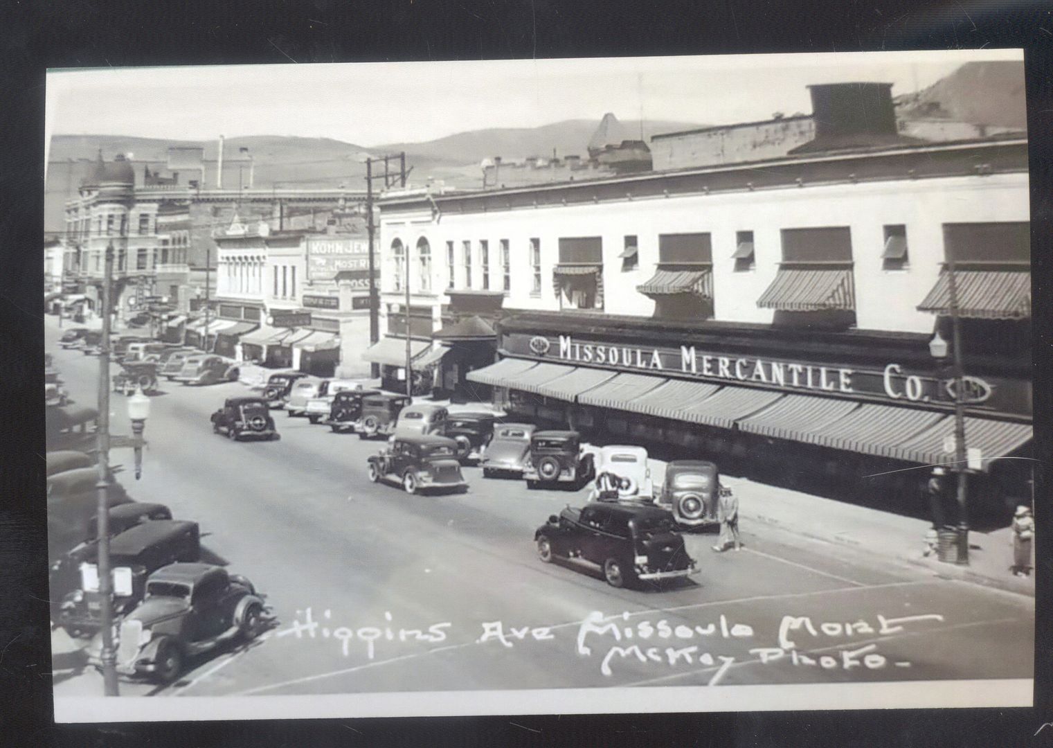 REAL PHOTO MISSOULA MONTANA DOWNTOWN STREET SCENE OLD CARS POSTCARD COPY