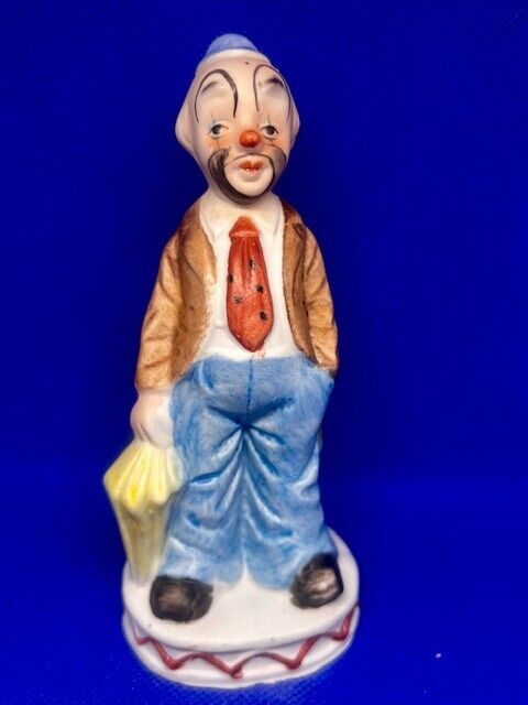 Vintage Hobo Clown with Yellow Umbrella and Orange Tie Figurine