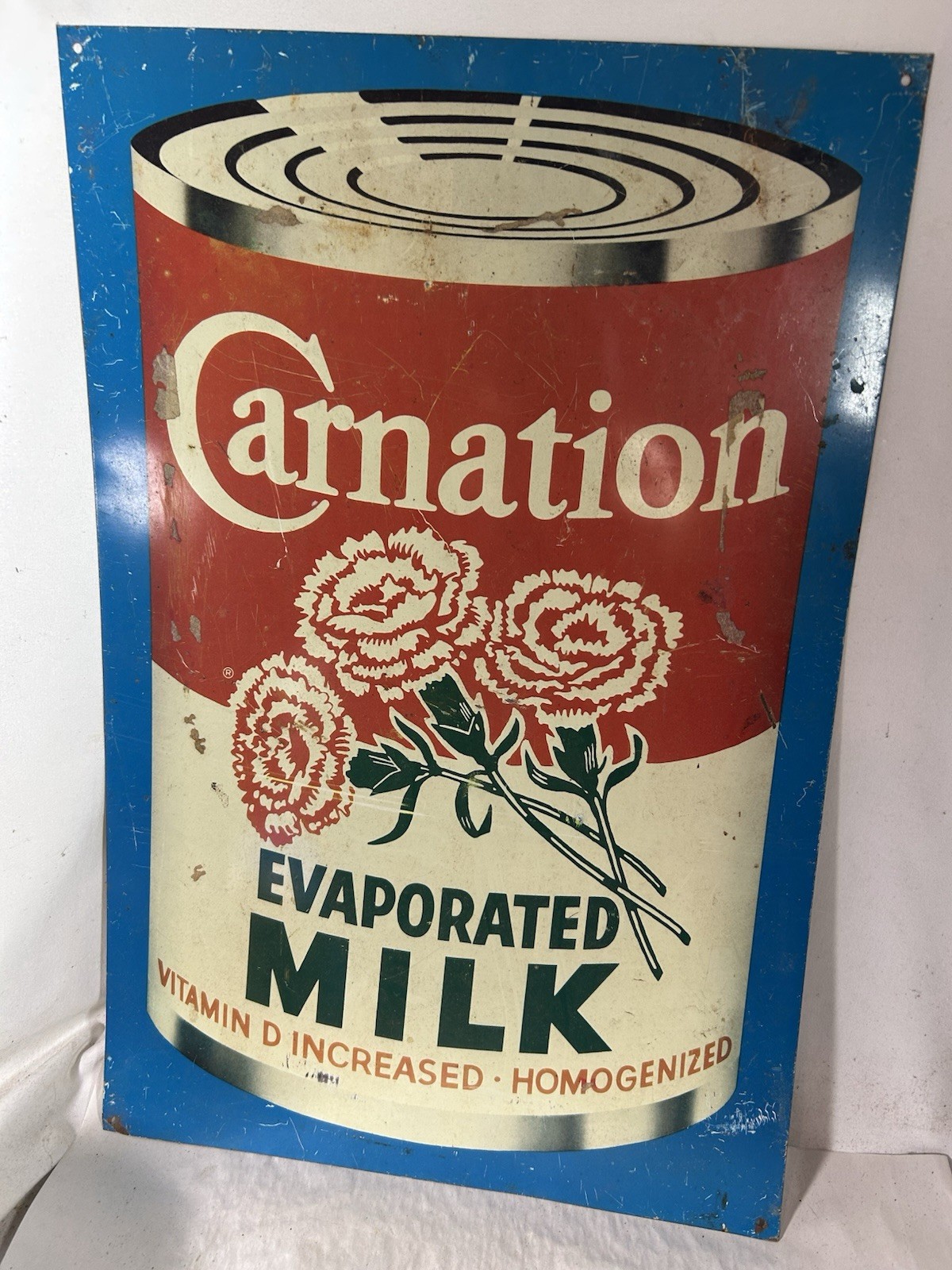 Vintage Carnation Evaporated Milk Tin Metal Tacker Sign Made In USA Advertising