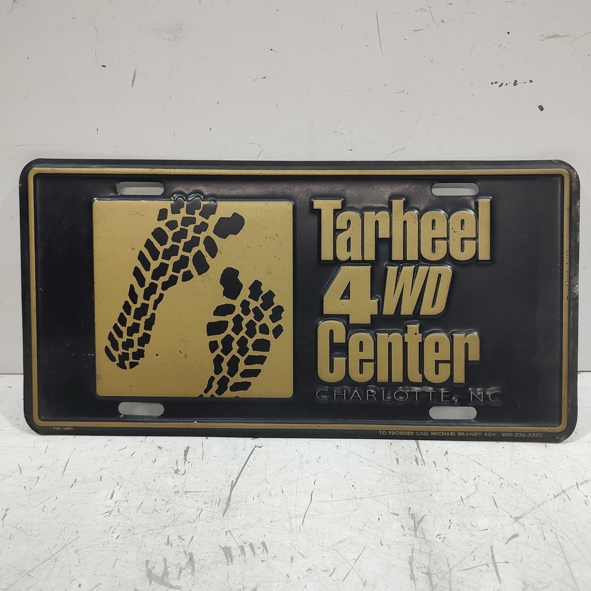 VTG Booster License Plate Tarheel 4wd Center Charlotte NC Black Gold GUC
