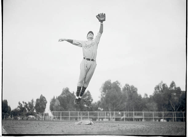 Stan Hack Leaping Through the Air 1933 Photo Going Up. Here is a real baseball