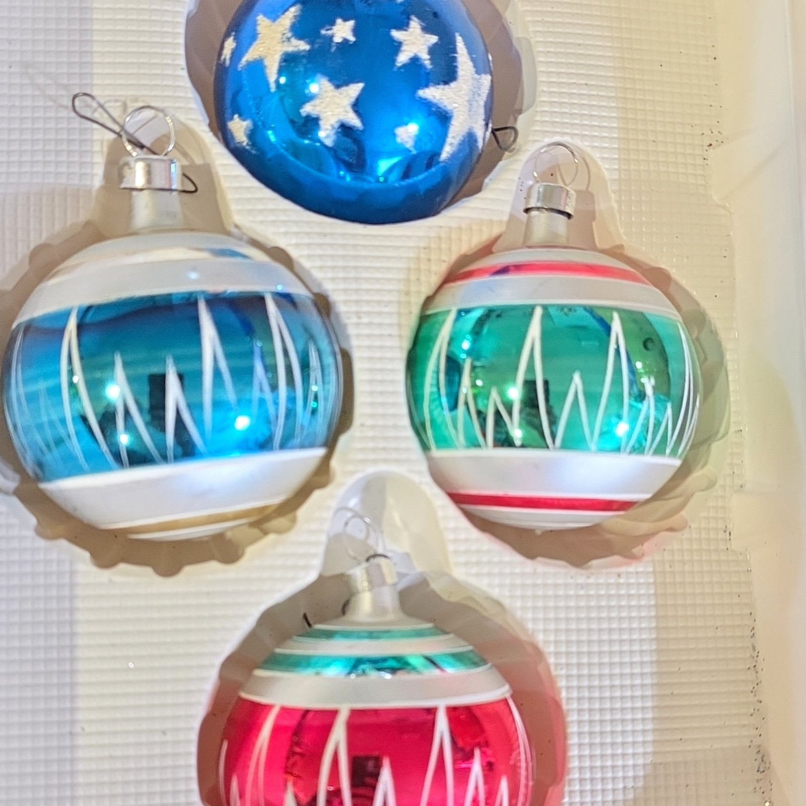 These are 4 mid-century  baubles.
