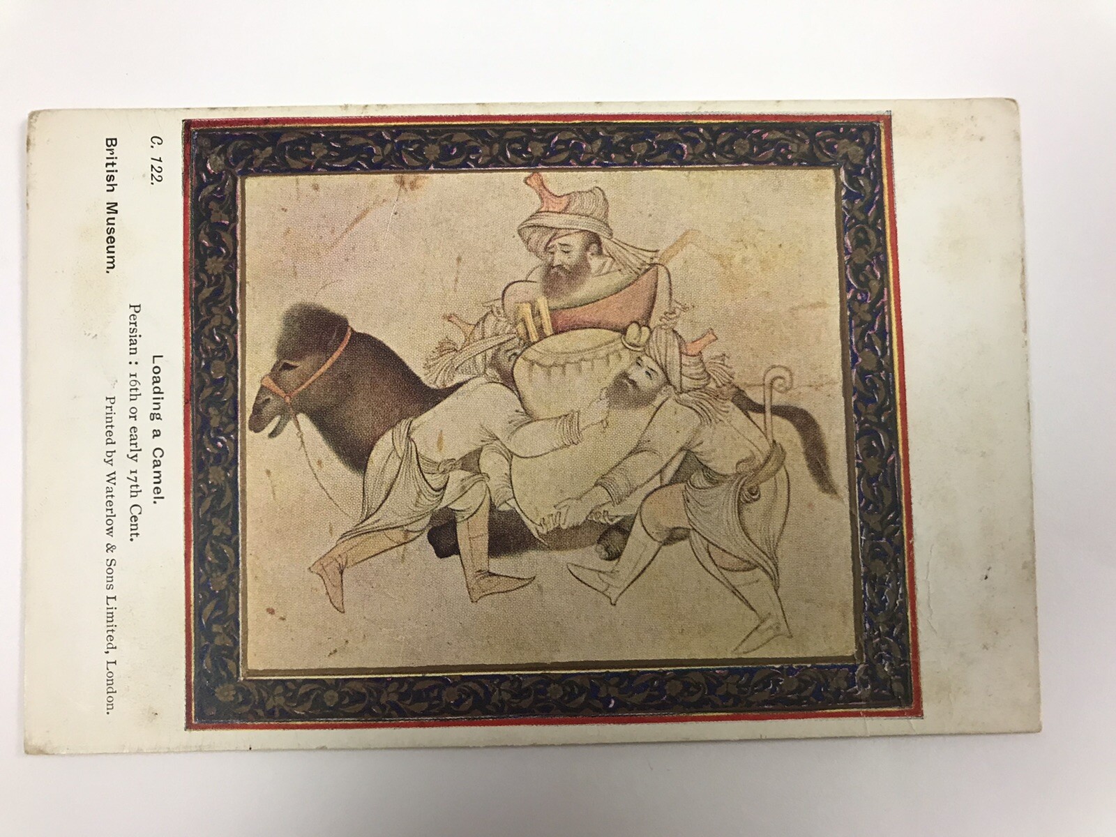 vintage 1928 loading a camel divided back postcard
