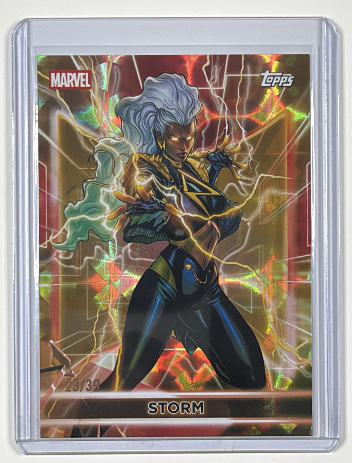 2026 Topps Marvel Neon, STORM Iron Man Red and Gold /39