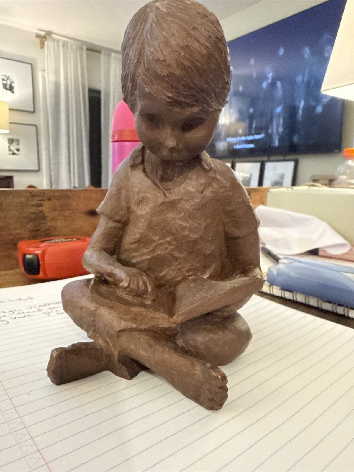 Single Bookend picturing Child Sitting and Reading A Book