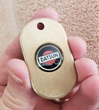 Vintage 1970's Datsun Keychain Automotive Dealer Promo Enameled Metal Key Fob picture