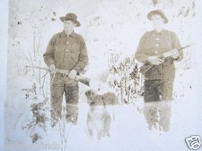 RPPC HUNTERS WITH DOGS RIFLES IN SNOWY WOODS c. 1910's REAL AZO PHOTO POSTCARD picture