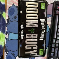 AUTHENTIC Walt Disney World Haunted Mansion Doom Bugy Car License Plate Tag NEW picture