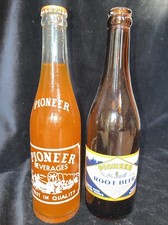 2 RARE VINTAGE BOTTLES PIONEER VALLEY BEVERAGES SODA Full Orange Texas Root Beer picture