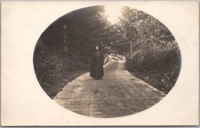 Vintage 1910s Real Photo RPPC Postcard / Woman in Black Dress Walking in Road picture