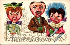 1910 Artist Postcard Three’s A Crowd Man With  2 Ladies Heart-Shaped Faces picture