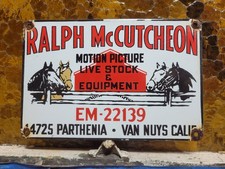 VINTAGE RALPH MCCUTCHEON PORCELAIN SIGN HOLLYWOOD LIVESTOCK MOVIE HORSE BARN picture