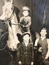 Antique Old RPPC Real Photo Postcard CHILD IN UNIFORM + STUFFED HORSE Weird 30's picture