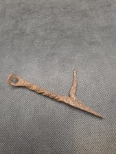 antique hand-forged iron harpoon or barbed arrow point featuring a looped eyelet picture