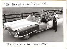 Johnny Cash poses at wheel of his One Piece At A Time Cadillac 8x10 inch photo picture