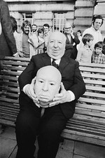 English film director Alfred Hitchcock with a model of his own fac- Old Photo picture