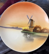 This vintage hand-painted porcelain plate was produced by Noritake (Morimura Bro picture