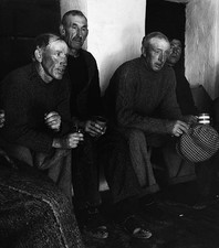 Residents of the Aran Islands hold a hearty singsong to welcome Ro- Old Photo picture