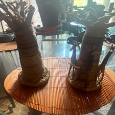 Pair of African Handmade Figurine Sculptures on Woven Bases - 2 Piece picture