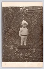 Cute Toddler in Yard Winter Ivy Fence Candid Photo RPPC Postcard 1911 picture