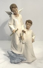 Nao by Lladro Porcelain Figurine “Lighting the Heavens” #1335 No Box picture