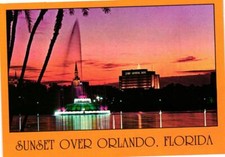 Sunset Over Orlando Florida Postcard picture
