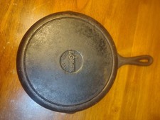 vintage Lodge Cast Iron Skillet featuring the raised