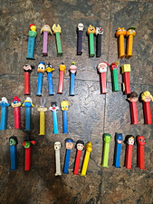 Lot of 34 PEZ Dispensers Cartoon Characters Disney Warner Bros Snoopy Garfield picture