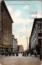 1909 East Fayette St Syracuse NY Postcard Busy Street Trolley Wires picture
